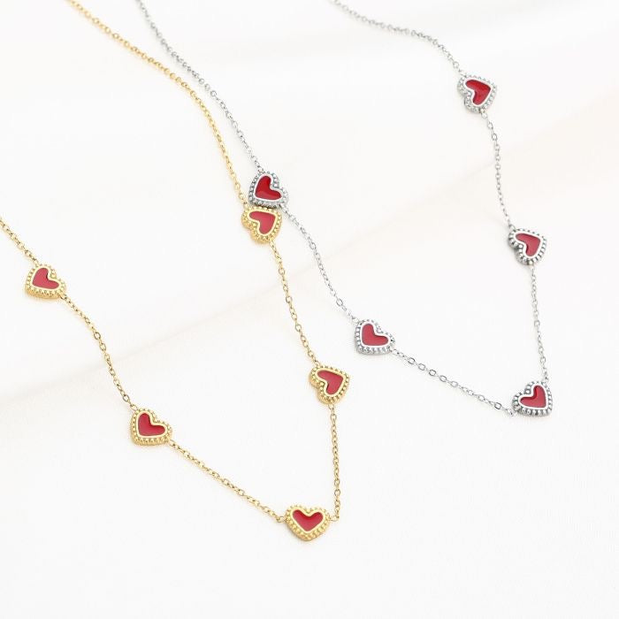 Goudkleurige en zilverkleurige ketting met rode hartjes van stainless steel