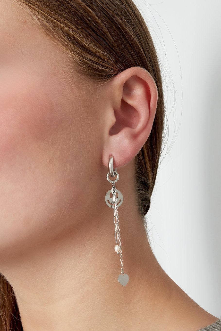 oorbellen- smiley chains goudkleurig