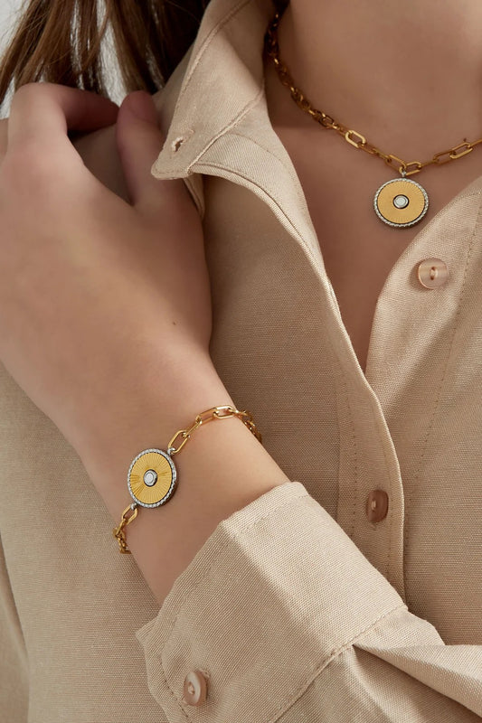 Armbandje- munt goudkleurig