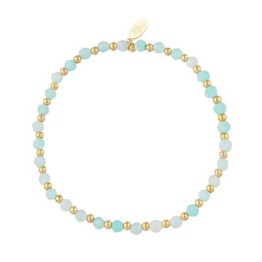 Armbandje- blauwe kraaltjes goudkleurig