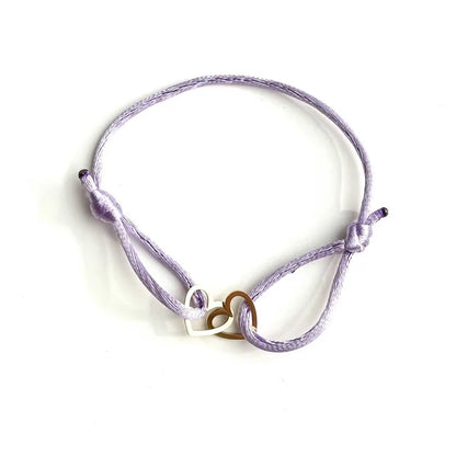 Lila koordarmbandje met twee hartjes van stainless steel, Jewelrybyceline sieraden