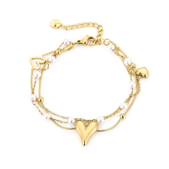 armbandje met pareltjes en hartjes goudkleurig stainless steel