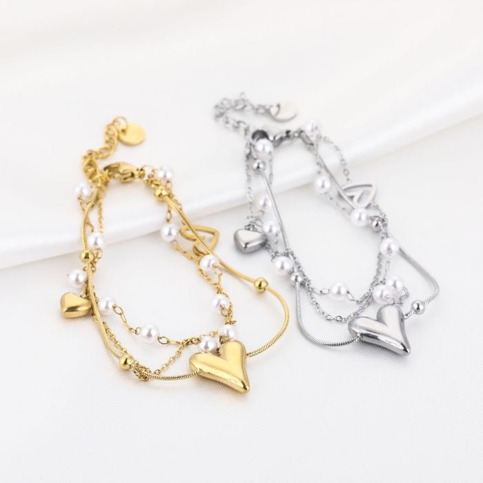 armbandjes met pareltjes en hartjes goudkleurig en zilverkleurig 