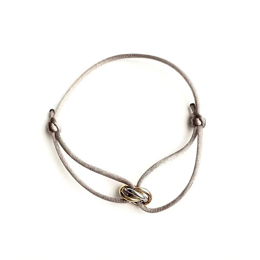 armband met tricolor ringetjes en satijnkoord