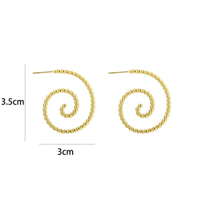 gedraaide hoops goudkleurig stainless steel