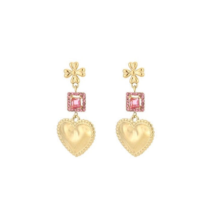 Goudkleurige statement oorbellen met hart en roze steentjes van stainless steel